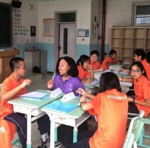 Teacher in China talking to student in class